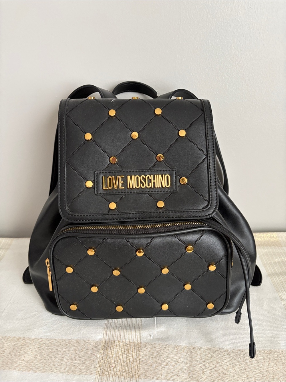 BNWOT Designer LOVE MOSCHINO Backpack, Faux Leather, with gold metal design.